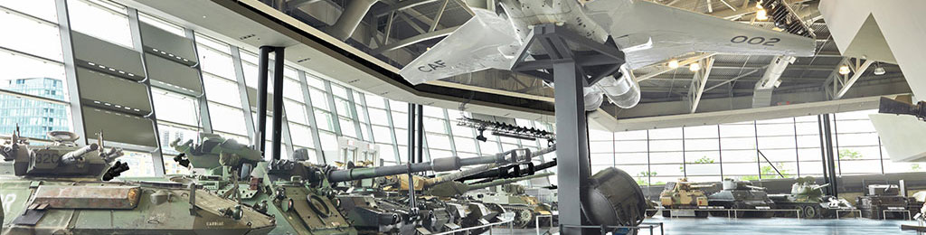 Photo of the Canadian War Museum’s Lebreton Gallery showing military vehicles, weapons, and equipment